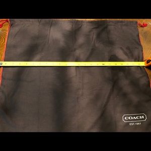 19/23 brown red trim Coach cloth bag.